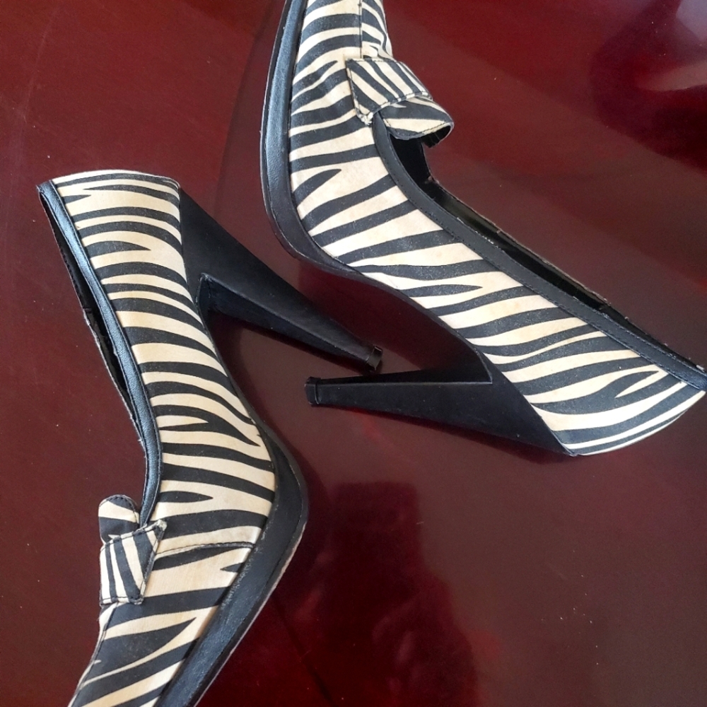 Colin Stuart Spikes Zebra print with solid black heels. Size 8.5. Gently used.